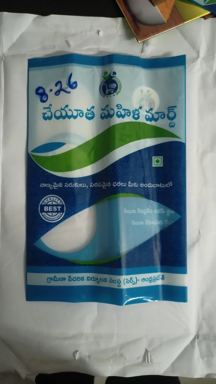 Printed blue and green flexible poly bag for Cheyutha Mahila Mart with Telugu text and a quality guaranteed seal